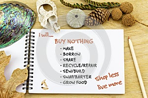 Note book with I will buy less text, Shop less live more