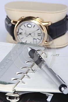 Note book, pen and watch