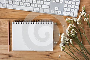 Note book with pencil on a wooden desk