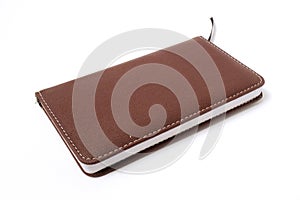 note book with rown leather cover on white background