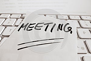 Note on computer keyboard: meeting