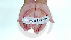 Note I have a dream in female hands on a white background