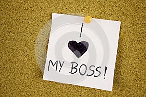 Note with i LOVE MY Boss. Sticky note with inscription pinned on a cork bulletin board