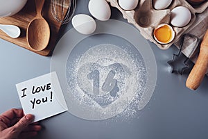 Note I love you, the numbers 14 and a heart of flour.