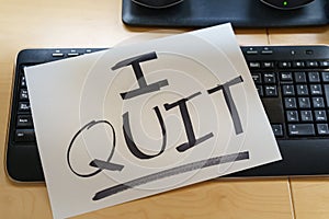 Note on a keyboard with the text I QUIT. Great resignation concept photo