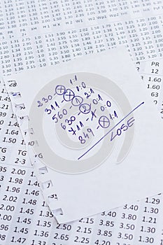 A note with the lose selection of the winning codes on bookmakers