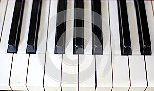 Note octave on ivory piano, horizontal photo