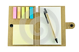Note pad with pen on white background