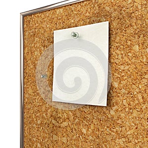 Note pad and push pin isolated on cork board