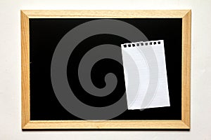 Note paper in black board with wood frame