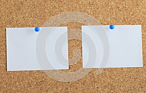 Note paper pined on cork board background