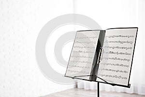 Note stand with music sheets. Space for text