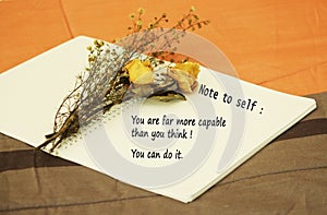 Note to self-you are far more capable than you think. You can do it. An inspirational & motivational quote concept with dried