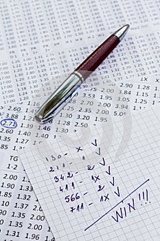 A note with the win selection of the winning codes on bookmakers