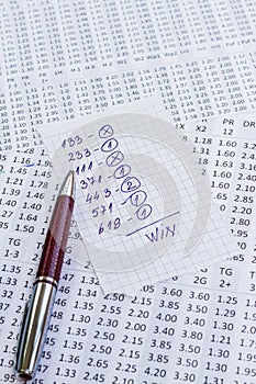 A note with the win selection of the winning codes on bookmakers
