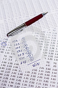 A note with the win selection of the winning codes on bookmakers