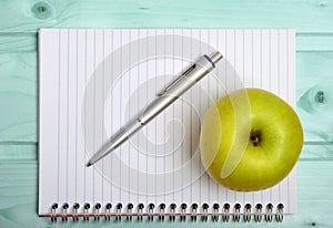 Notebook with apple fruit