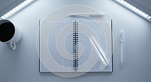 Notebook with binary code under LED light with coffee mug and glowing white pen