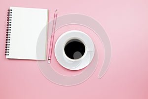 Notebook black coffee pencil on pink background pastel style wit