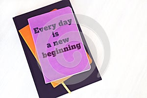 Notebook, book or diary with motivational quote: Every day is a