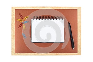 Notebook on brown textured paper imitating a frame