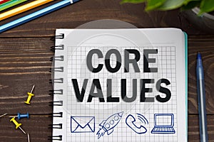 Notebook with a Business notes CORE VALUES on the office table w