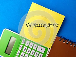 notebook and calculator with the word Webmaster