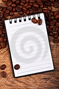 Notebook with coffee beans
