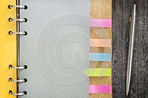 Notebook with colorful sticky bookmarks