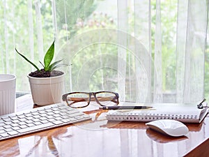Notebook with cup of coffee on working desk