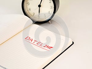 Notebook with Dateline written with a clock