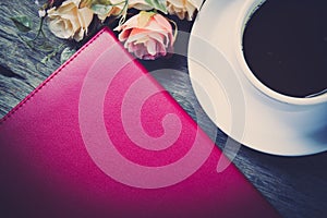 notebook, flower and cup of coffee