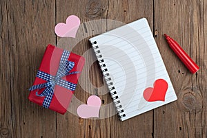 Notebook with gift, felt pen and hearts