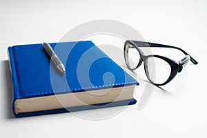 Notebook with glasses and pen, Book with glasses, Blue notebook