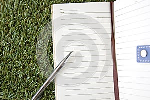 Notebook on grass