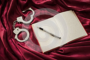 Notebook and handcuffs