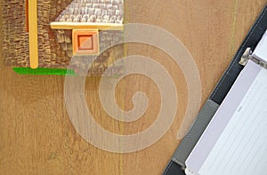 notebook & house model on wooden desk. realtor real estate agent