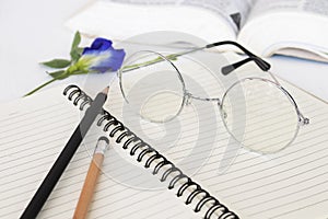 Notebook memo ,dictionary book and spectacle of student for study