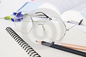 Notebook memo ,dictionary book and spectacle of student for study