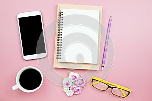 Notebook mobile phone black coffee flower rose yellow glasses on