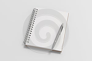 Notebook mockup. Opened blank notebook and pen. Spiral notepad on white background