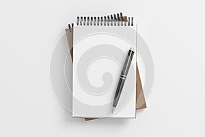 Notebook mockup. Two notebooks in a stack and pen. Spiral notepad on white background