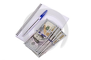 Notebook, money, pen on a white background