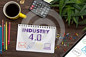 Notebook with a notes INDUSTRY 4.0 on the office table with tool