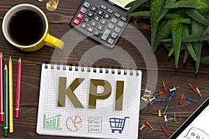 Notebook with a notes KPI on the office table with tools.