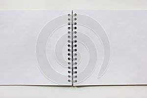 Open spiral notebook. Blank white notepad pages