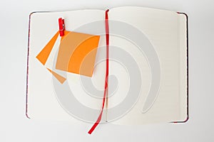 Notebook with orange stickers.