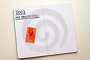 Notebook page, with text ` 2023 priorities`. photo