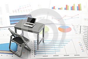 Notebook PC and business documents with numbers and charts.