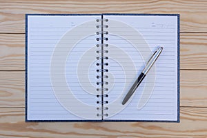 Blank opened white notebook and fountain pen, mockup design template